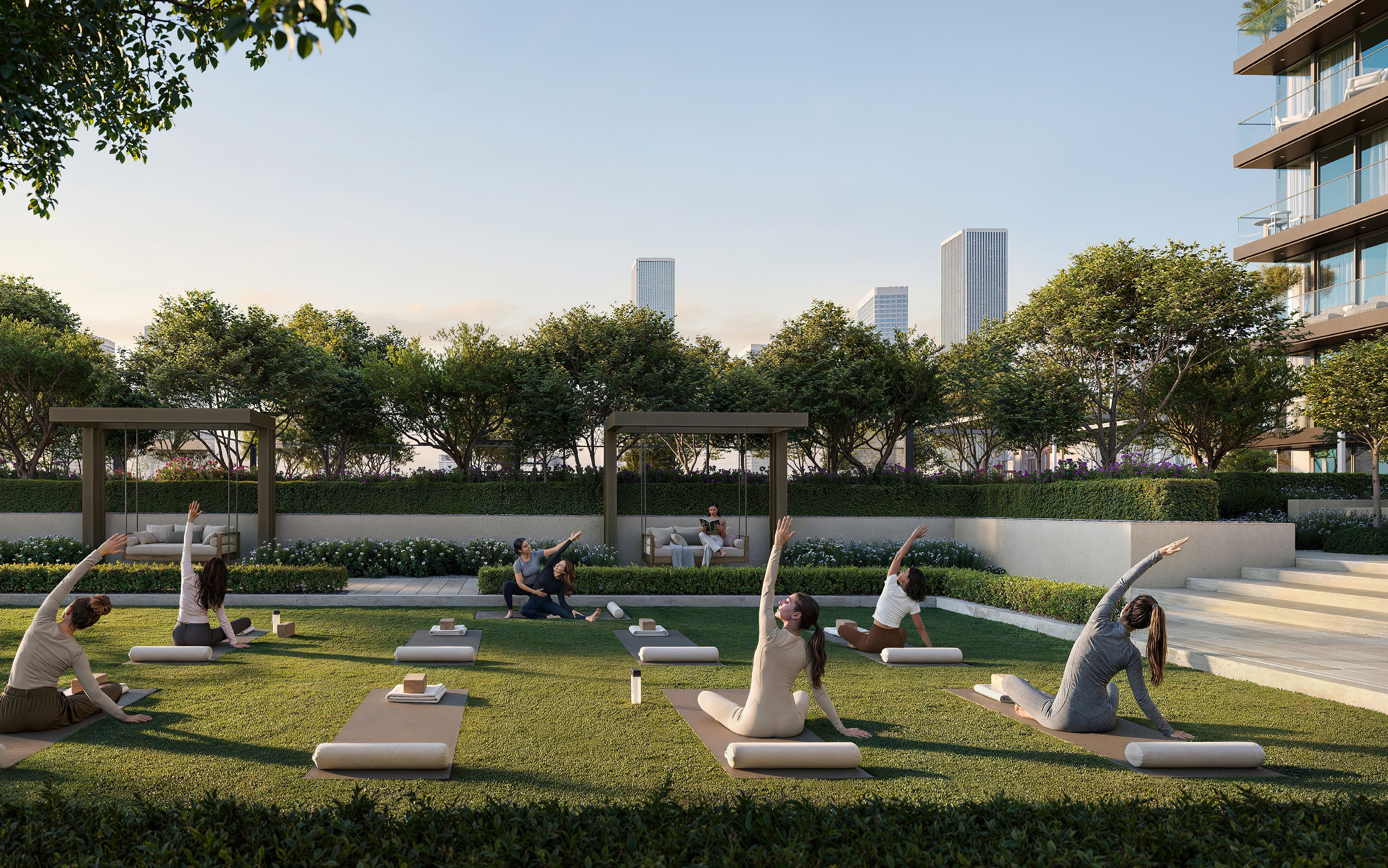 Yoga class on a garden lawn framed by hedges and swing seats