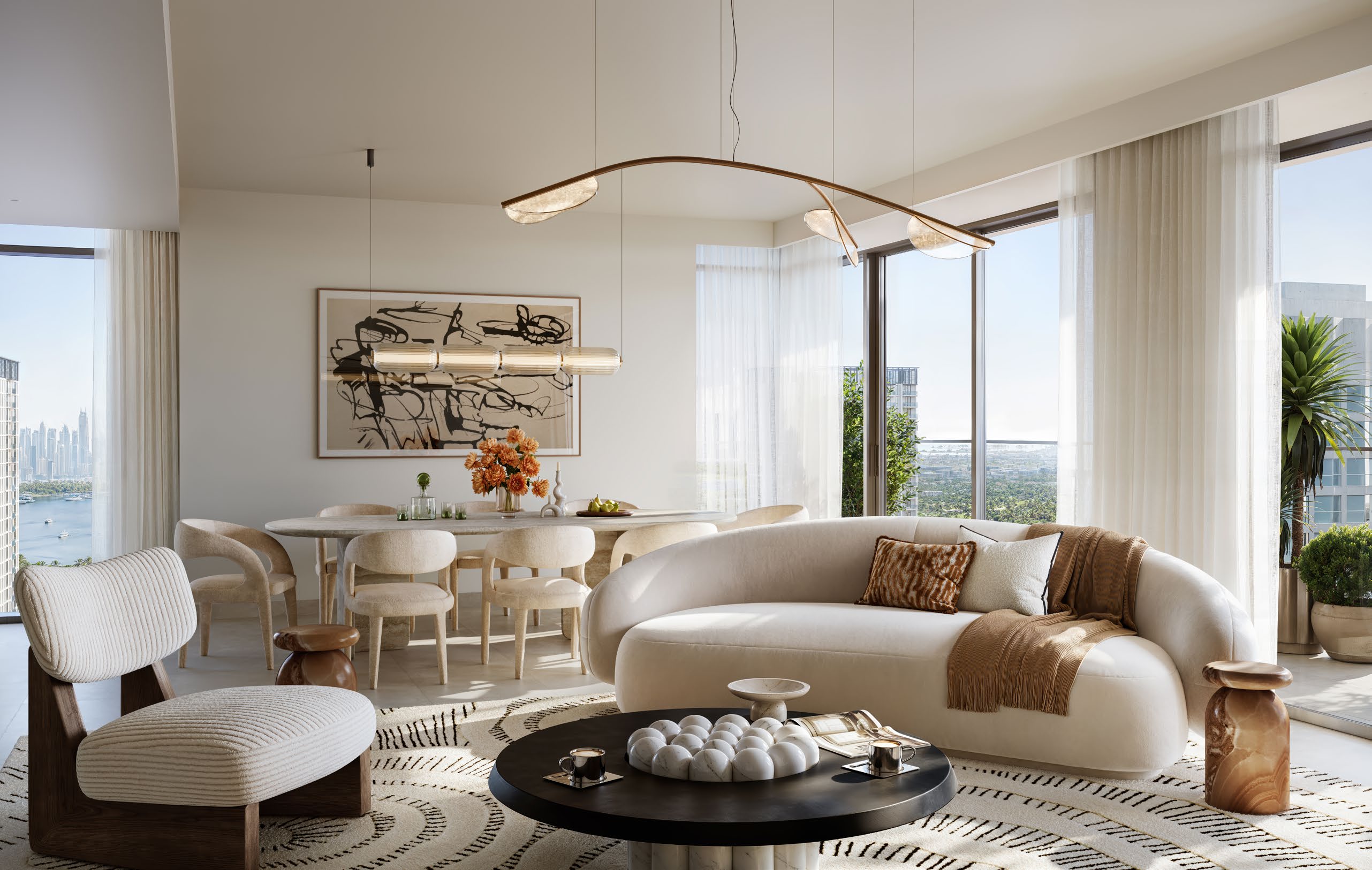 Open living and dining space with sheer curtains and views towards the water
