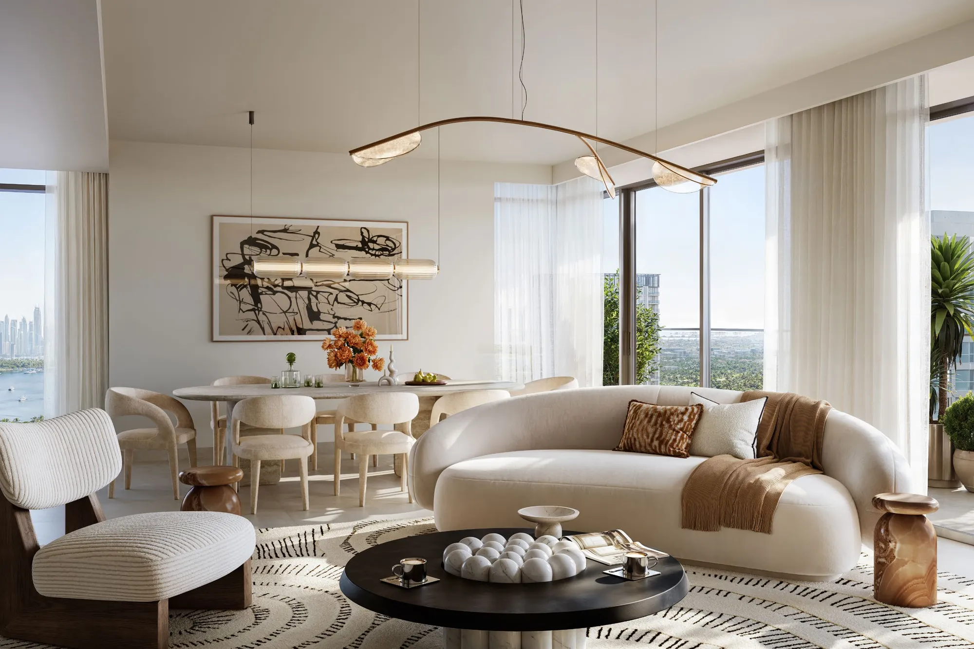 Open living and dining space with sheer curtains and views towards the water